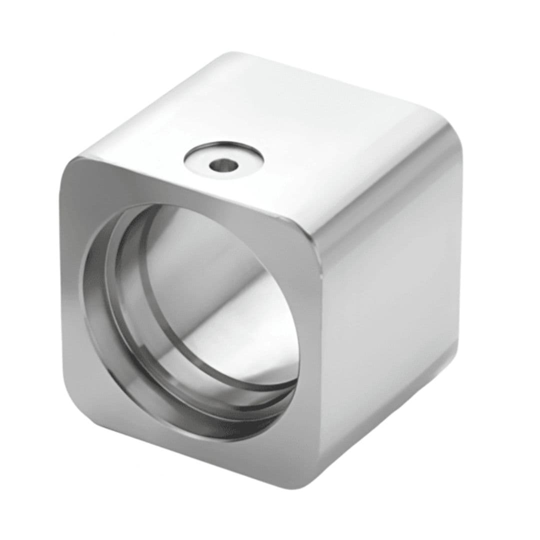 Precision machined cube manifold with large internal bore